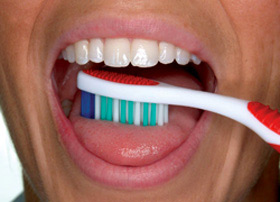 Brush your tongue to remove bacteria and freshen your breath.