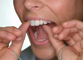 Hold the floss tightly between your thumbs and forefingers. Guide the floss between your teeth, using a gentle rubbing motion. To avoid hurting your gums, never snap the floss into gum tissue.